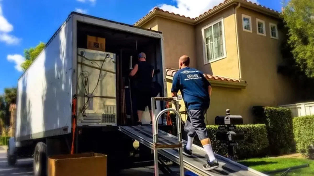 Tiger Mover team loading boxes into a moving truck in Abu Dhabi