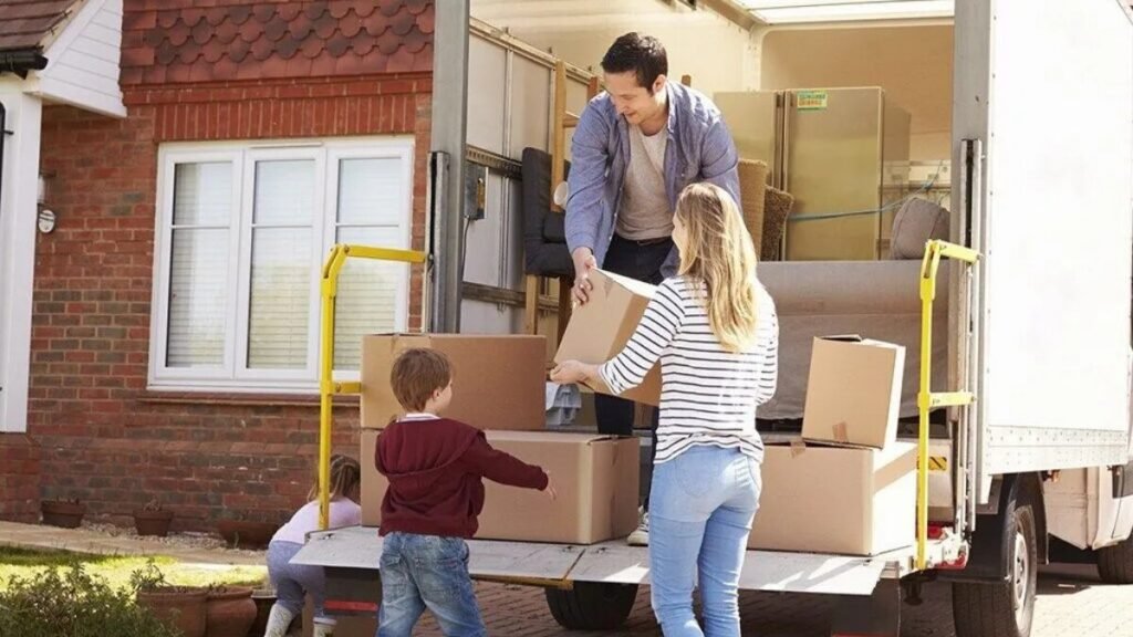 Family unpacking boxes after moving to a new villa in Abu Dhabi with Tiger Movers