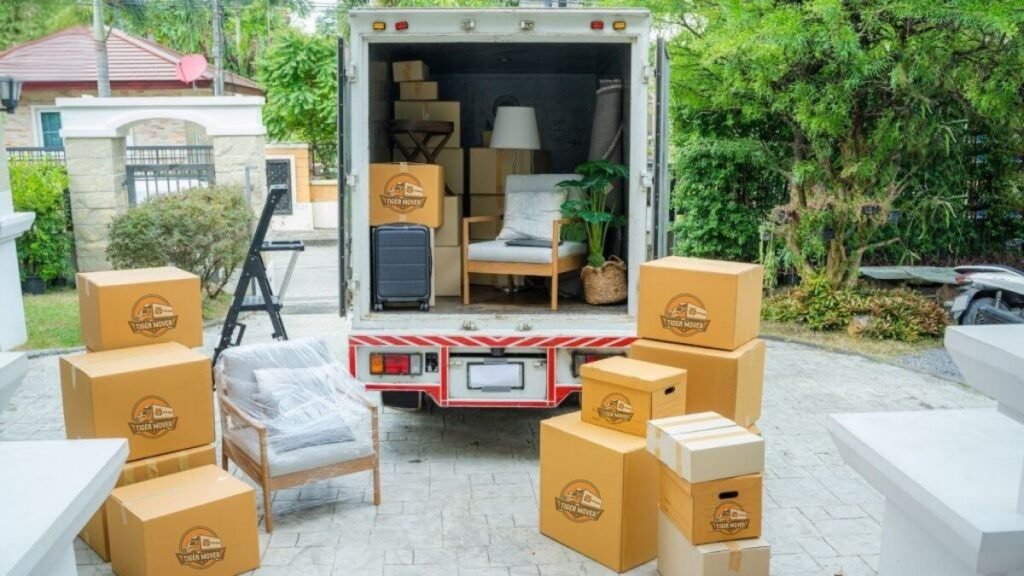 Tiger Movers branded truck driving to a villa moving site in Abu Dhabi