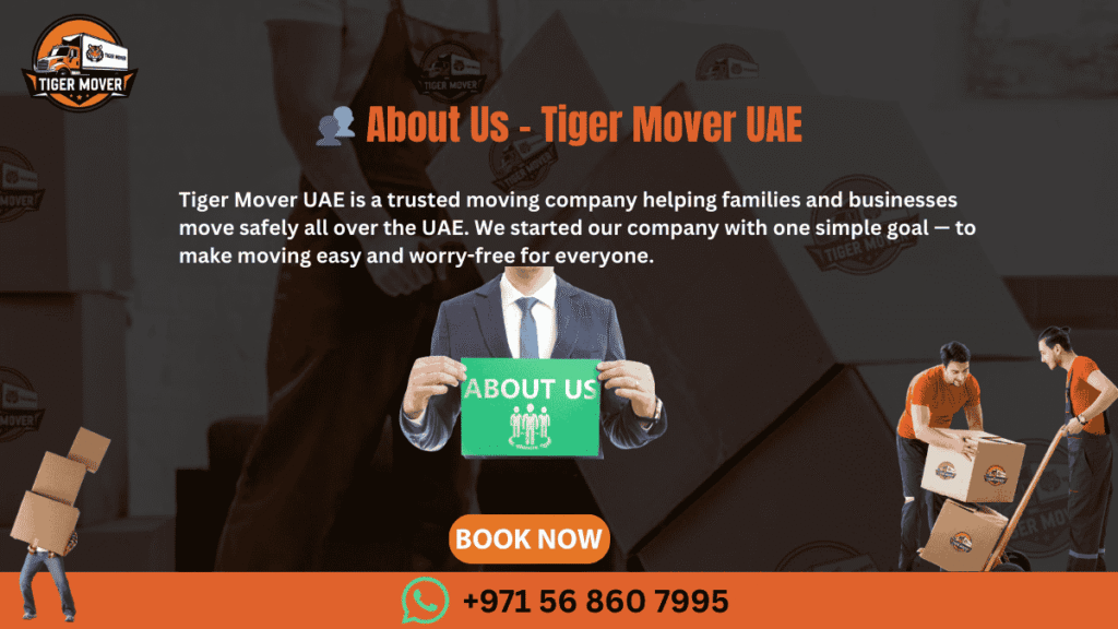 Team of professional movers from Tiger Mover UAE standing in front of branded moving truck.