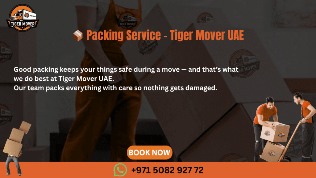 Professional packers from Tiger Mover UAE carefully wrapping and packing household items into labeled boxes.