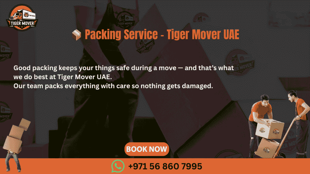 Professional packers from Tiger Mover UAE carefully wrapping and packing household items into labeled boxes.