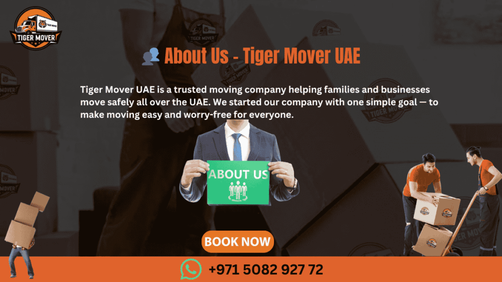 Team of professional movers from Tiger Mover UAE standing in front of branded moving truck.